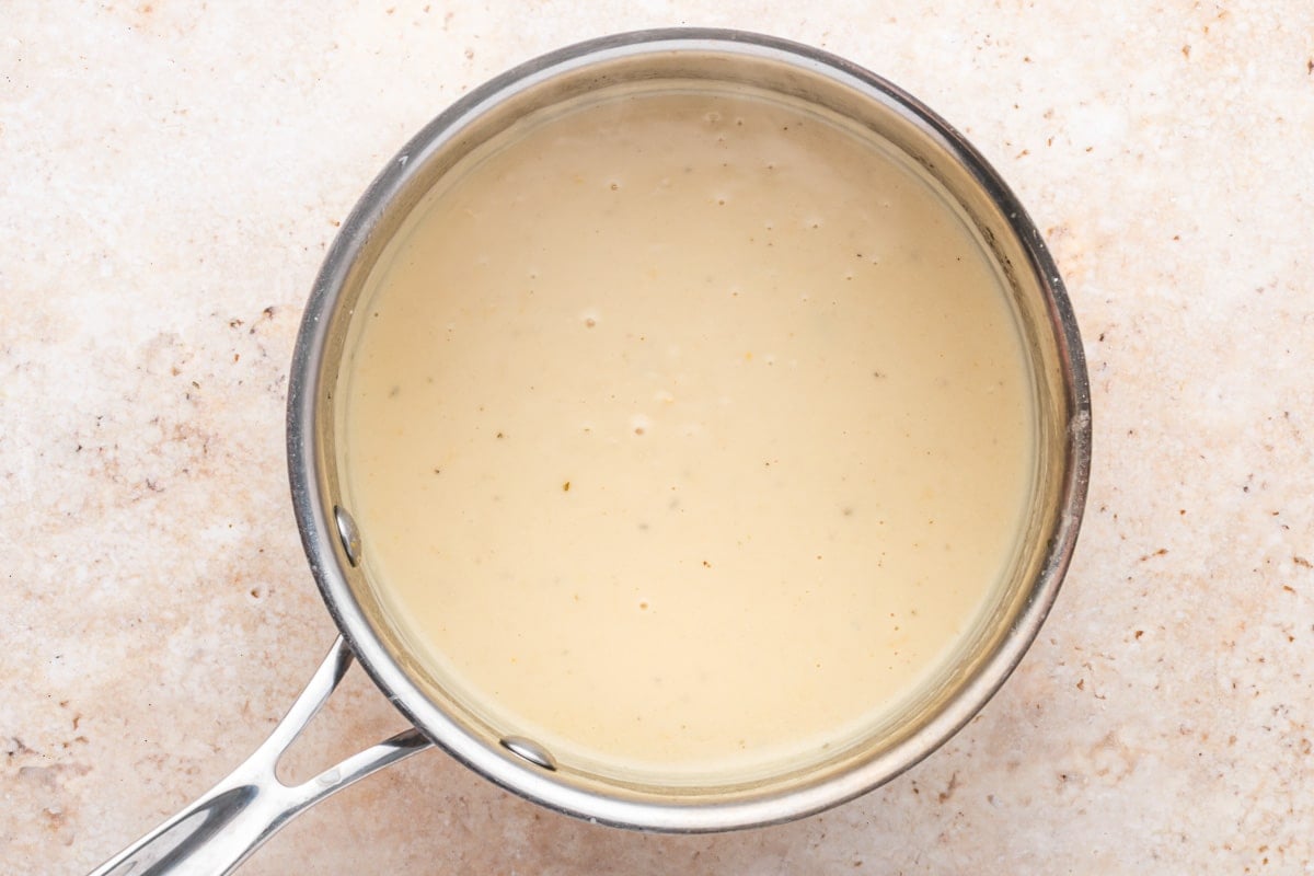 creamy lemon dijon sauce in a saucepan