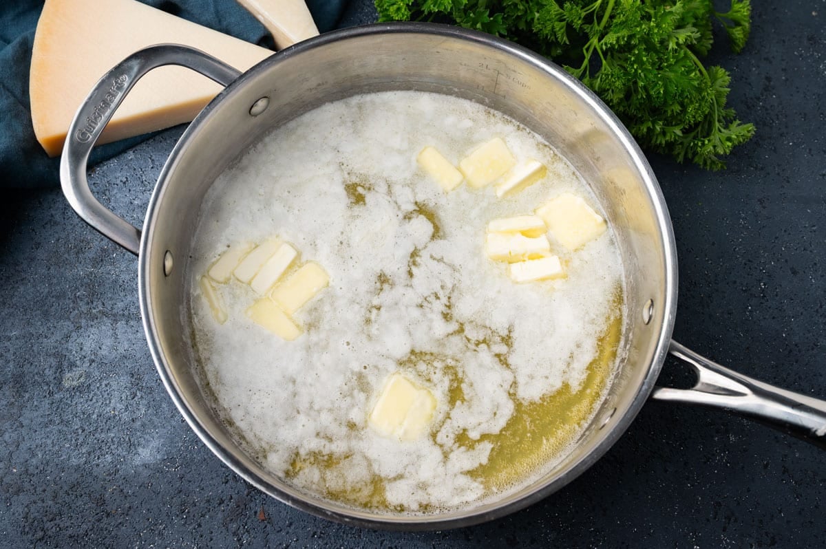 sliced butter melting in a skillet