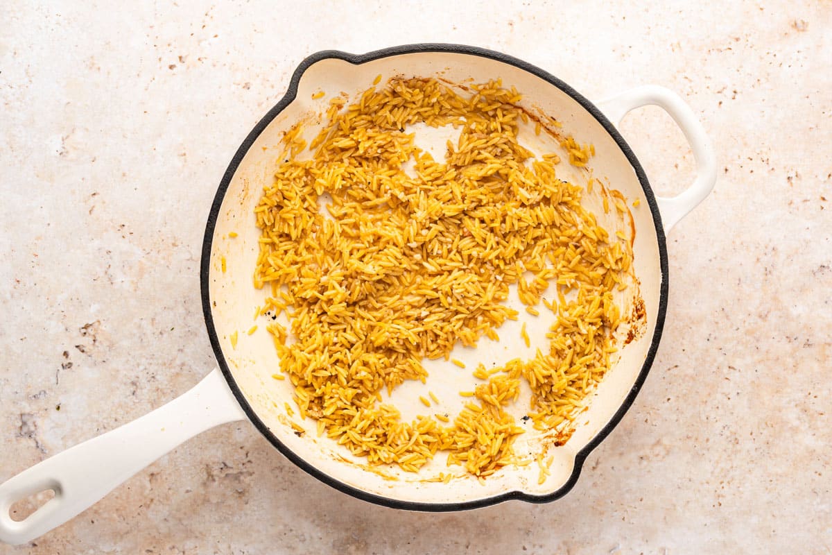 orzo sauteed in a skillet