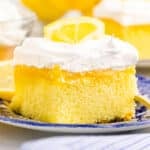 a piece of lemon poke cake on a plate