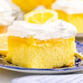 a piece of lemon poke cake on a plate