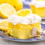 a slice of lemon poke cake on a plate with a fork