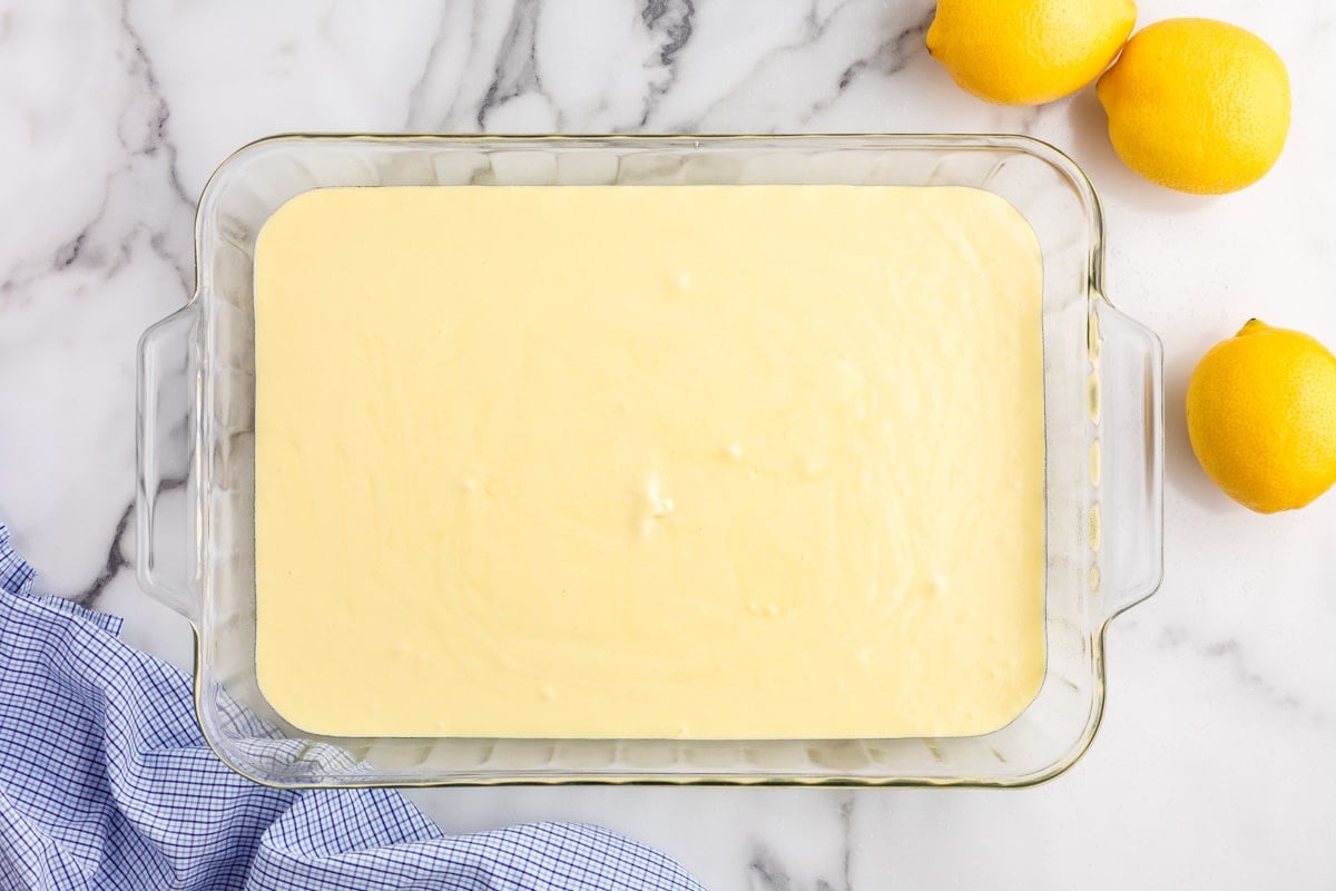 unbaked lemon cake in a glass pan
