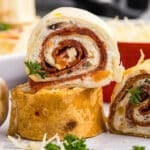 closeup of pepperoni rollups on a plate