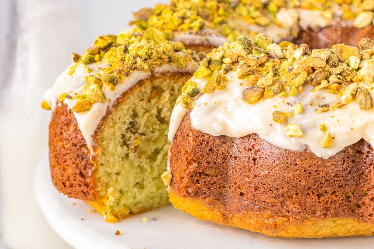 glazed pistahio bundt cake on a plate