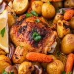 closeup of overhead view of sheet pan chicken thighs with veggies