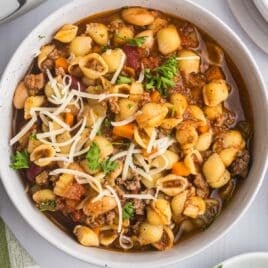 a bowl of pasta fagioli on a table