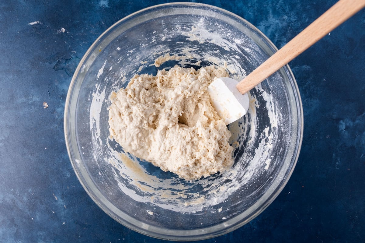 dough in a bowl with a rubber spatula