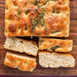 sourdough focaccia sliced on a cutting board