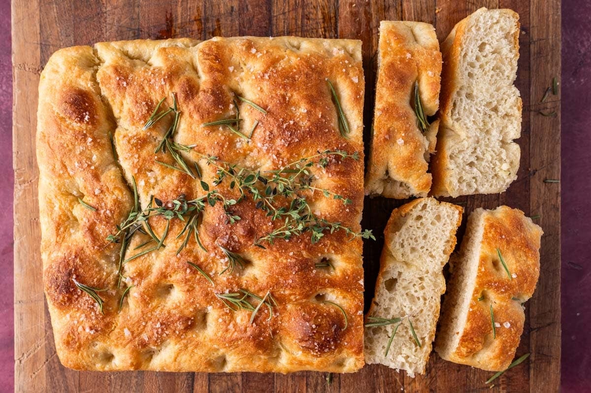 sourdough focaccia on a table cut into slices