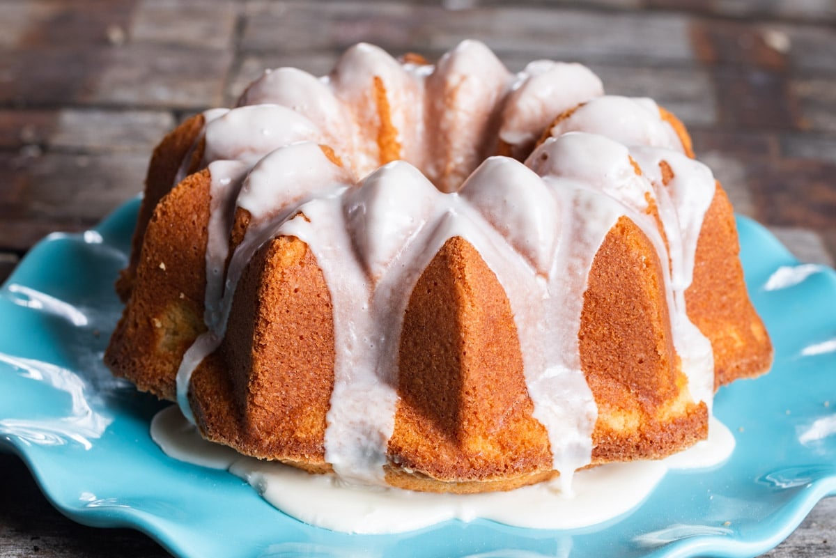 a bundt cake on a plate with frosting