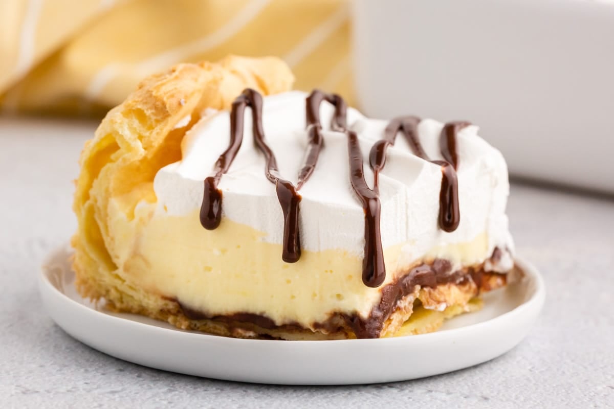 a piece of cream puff cake on a plate