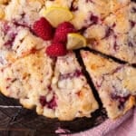 overhead view of lemon raspberry cake sliced 8 slices
