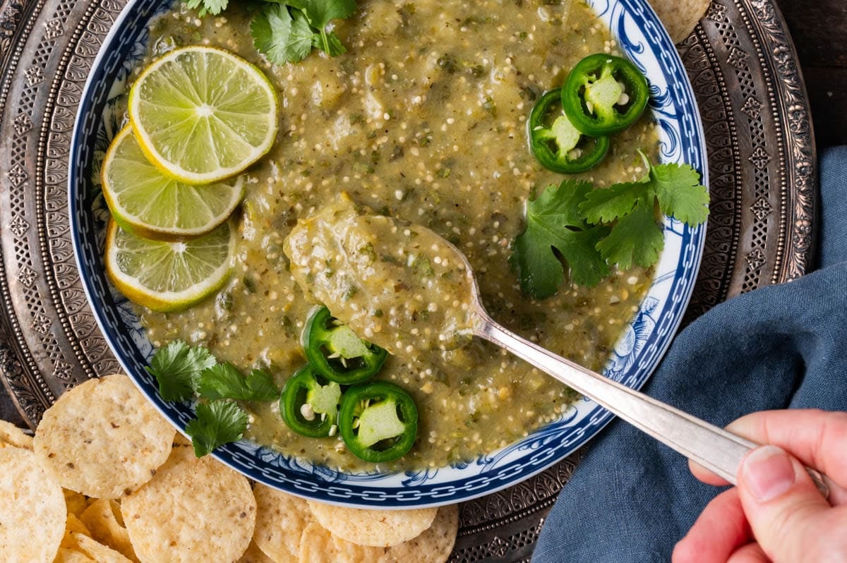 salsa verde in a bowl, with some on a spoon