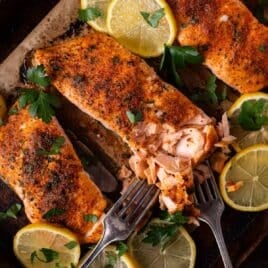 a piece of baked salmon on a baking sheet