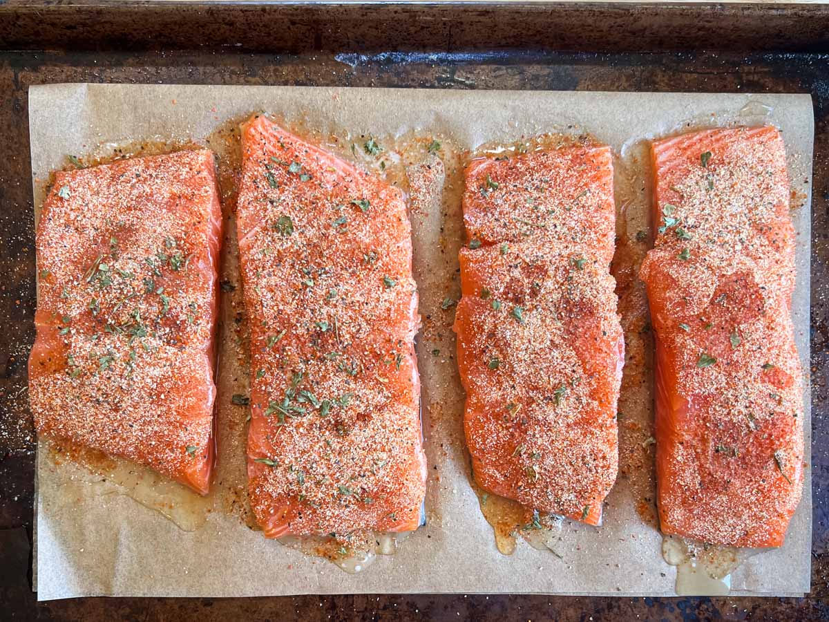 unbaked salmon on a pan