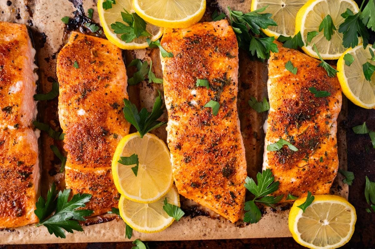 baked salmon with lemons on a pan