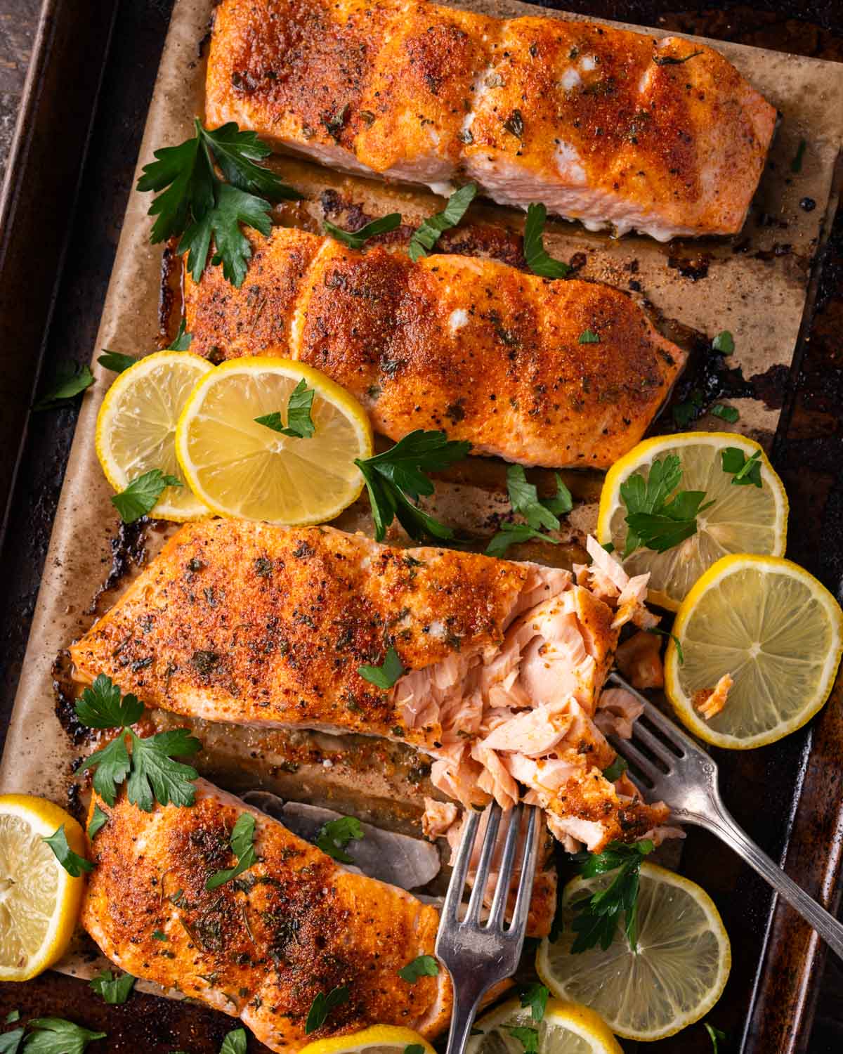 overhead view of baked salmon on a pan