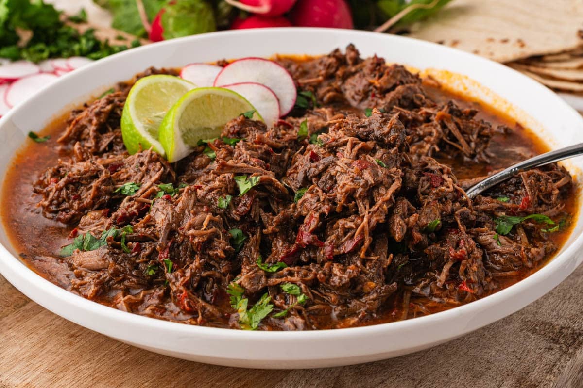a bowl of shredded barbacoa beef