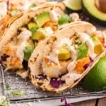 closeup of flaky fish tacos on a table