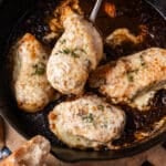 a piece of french onion chicken with cheese on a spoon