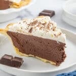 a slice of french silk pie with whipped cream on top