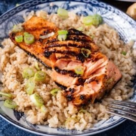 grilled salmon on a plate with rice