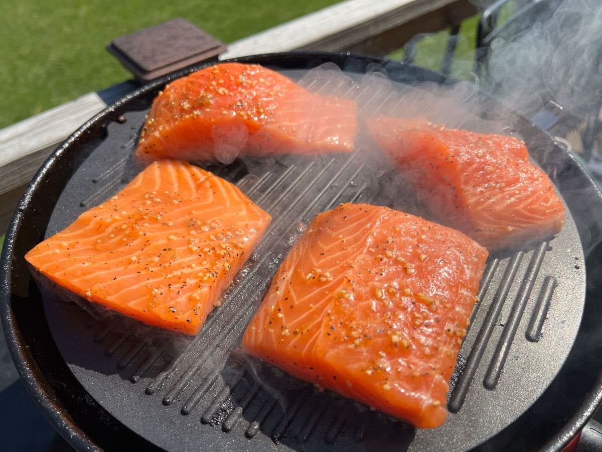 salmon cooking on a grill