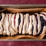 unbaked pull apart bread with jam in a pan