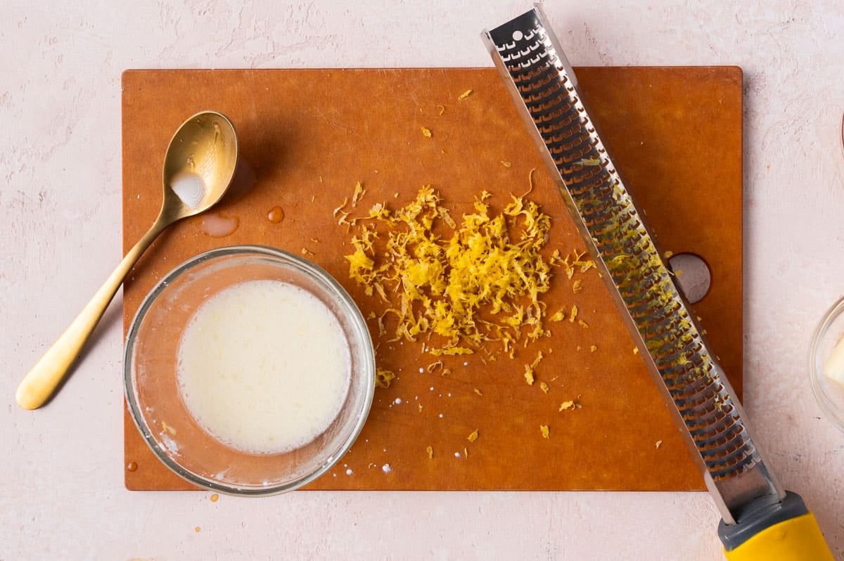 lemon zest and cornstarch slurry on a cutting board