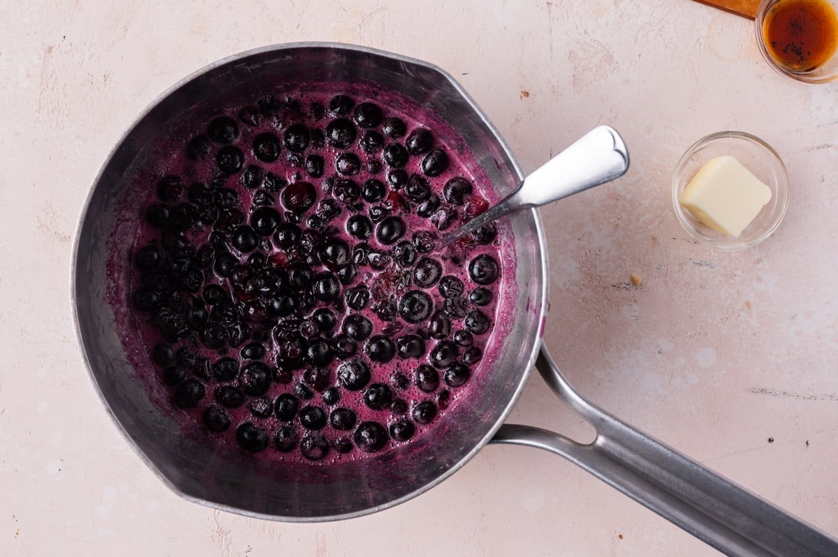 blueberry sauce in a pan on a table