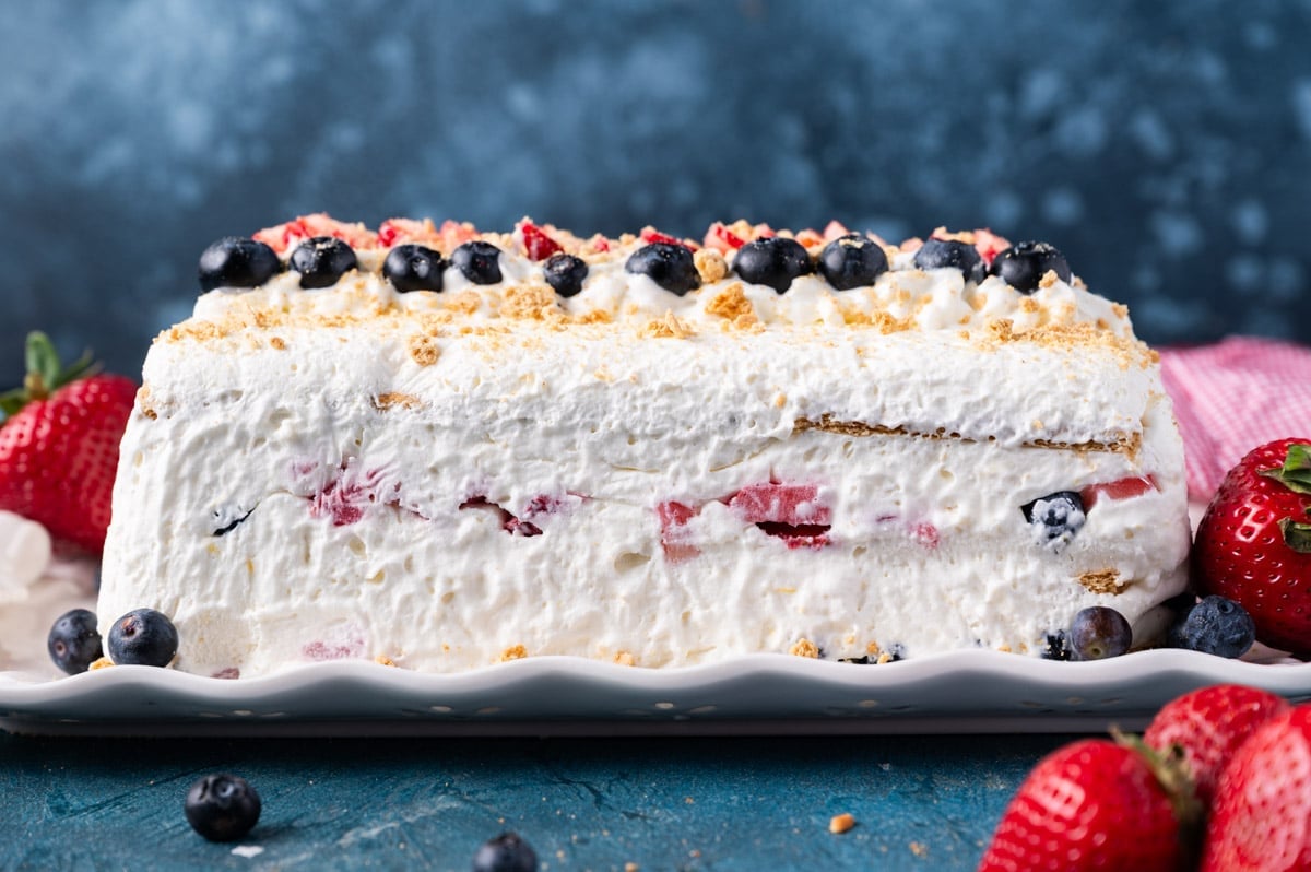mixed berry whipped cream icebox cake on a plate