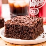 a slice of dr pepper cake on a table