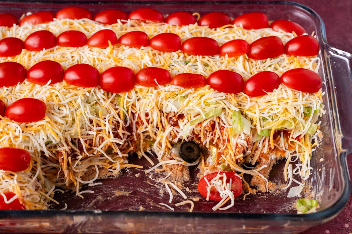 closeup of a 7 layer taco dip in a pan