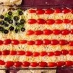 american flag taco dip on a table with tortilla chips