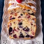 mixed berry bread sliced on a plate