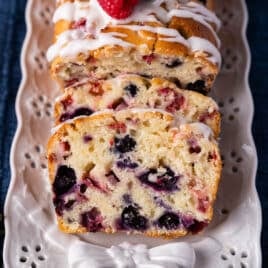 mixed berry bread sliced on a plate