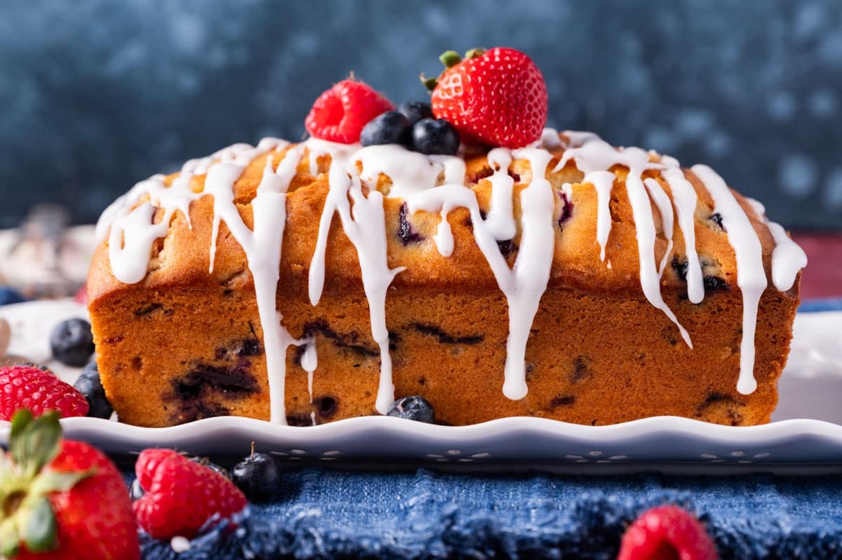 A loaf of berry bread on a plate