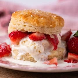 strawberry shortcake biscuit on a plate with ice cream