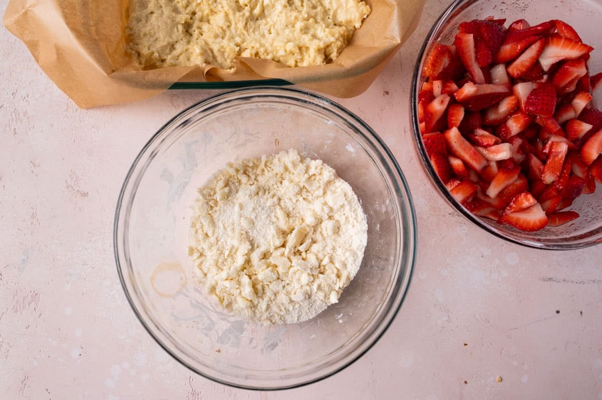 crumb topping and strawberries for shortcake on a table