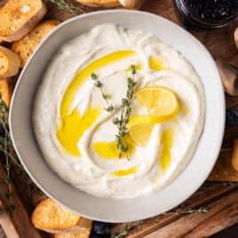 a bowl of whipped ricotta with lemon and olive oil
