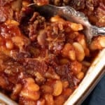 3 bean baked beans in a dish with a spoon