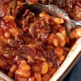 3 bean baked beans in a dish with a spoon