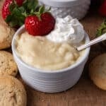 closeup of a bowl of vanilla pudding with whipped cream