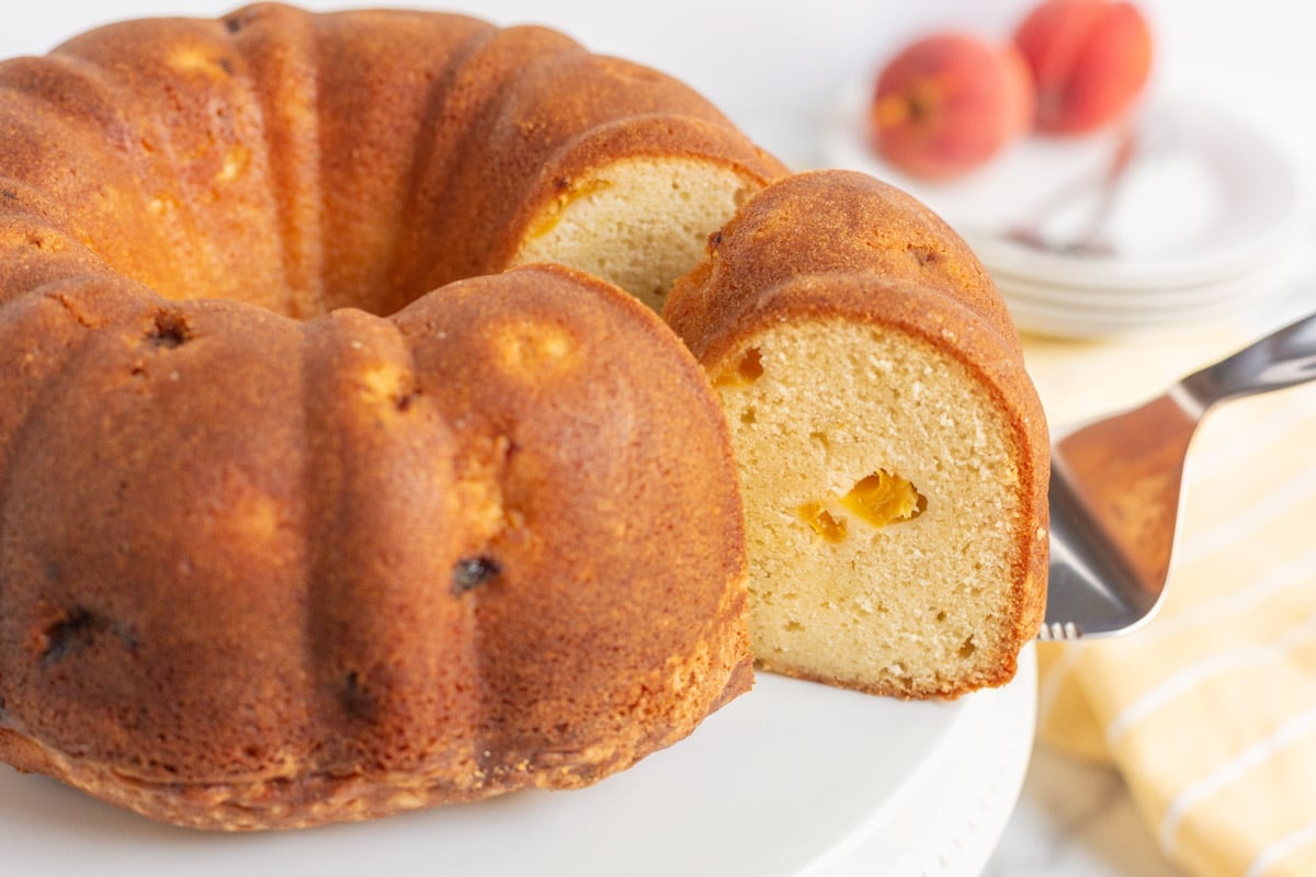 a slice of peach pound cake on a spatula