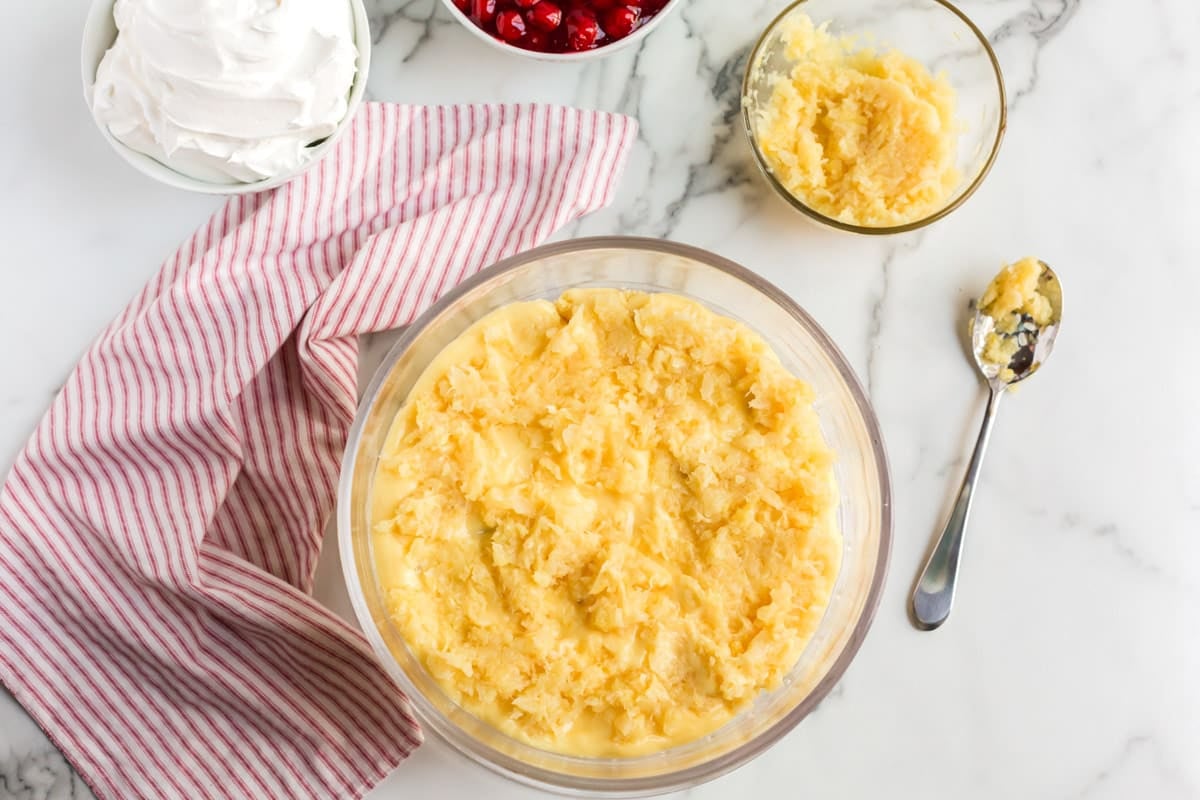 pineapple over pudding in a glass bowl