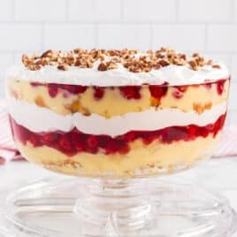 a punch bowl cake in a glass bowl on a table