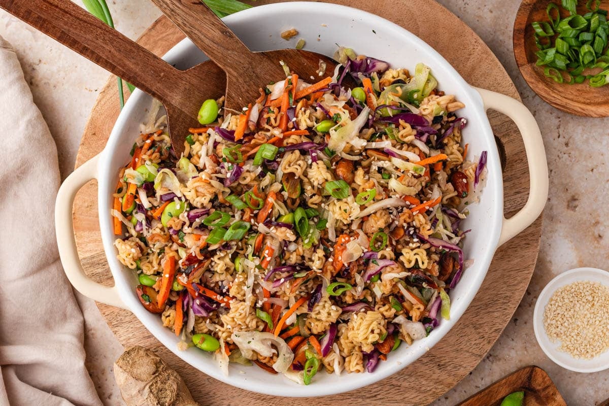 a bowl of ramen noodle salad on a table