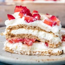 a piece of strawberry banana icebox cake on a plate