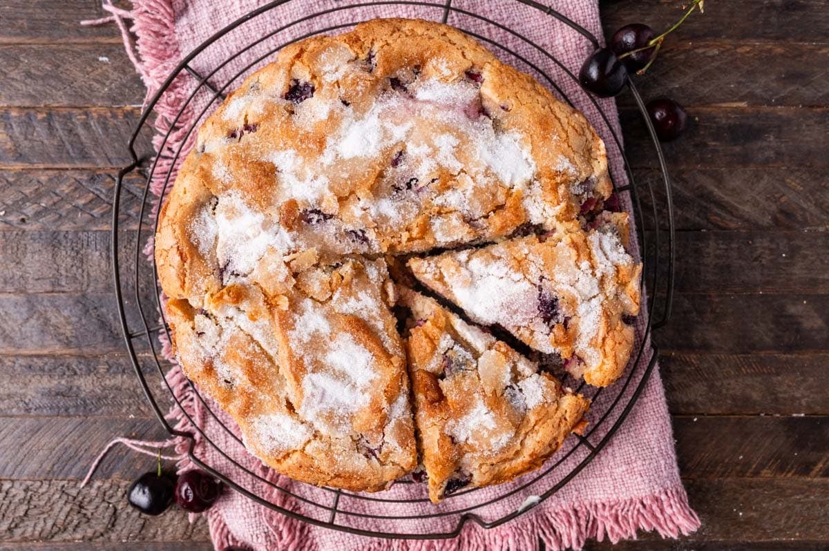 baked cake with fresh cherries